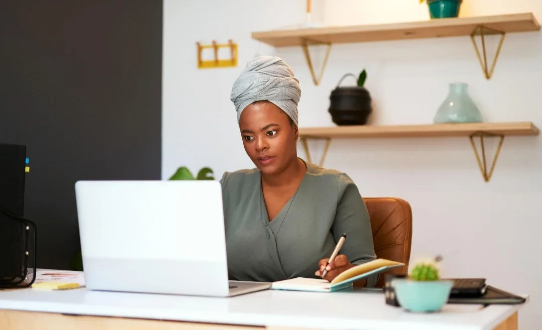 An entrepreneur trying to figure out expenses and cash flow of her business.